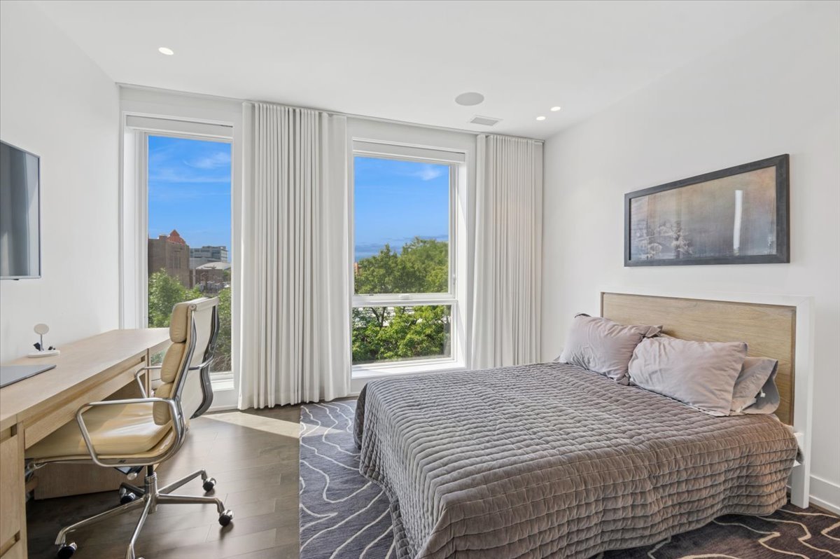 1625 North Burling Street, Unit 401 Chicago, IL 60614 - Photo 23 of 42 a bedroom with a bed and a window