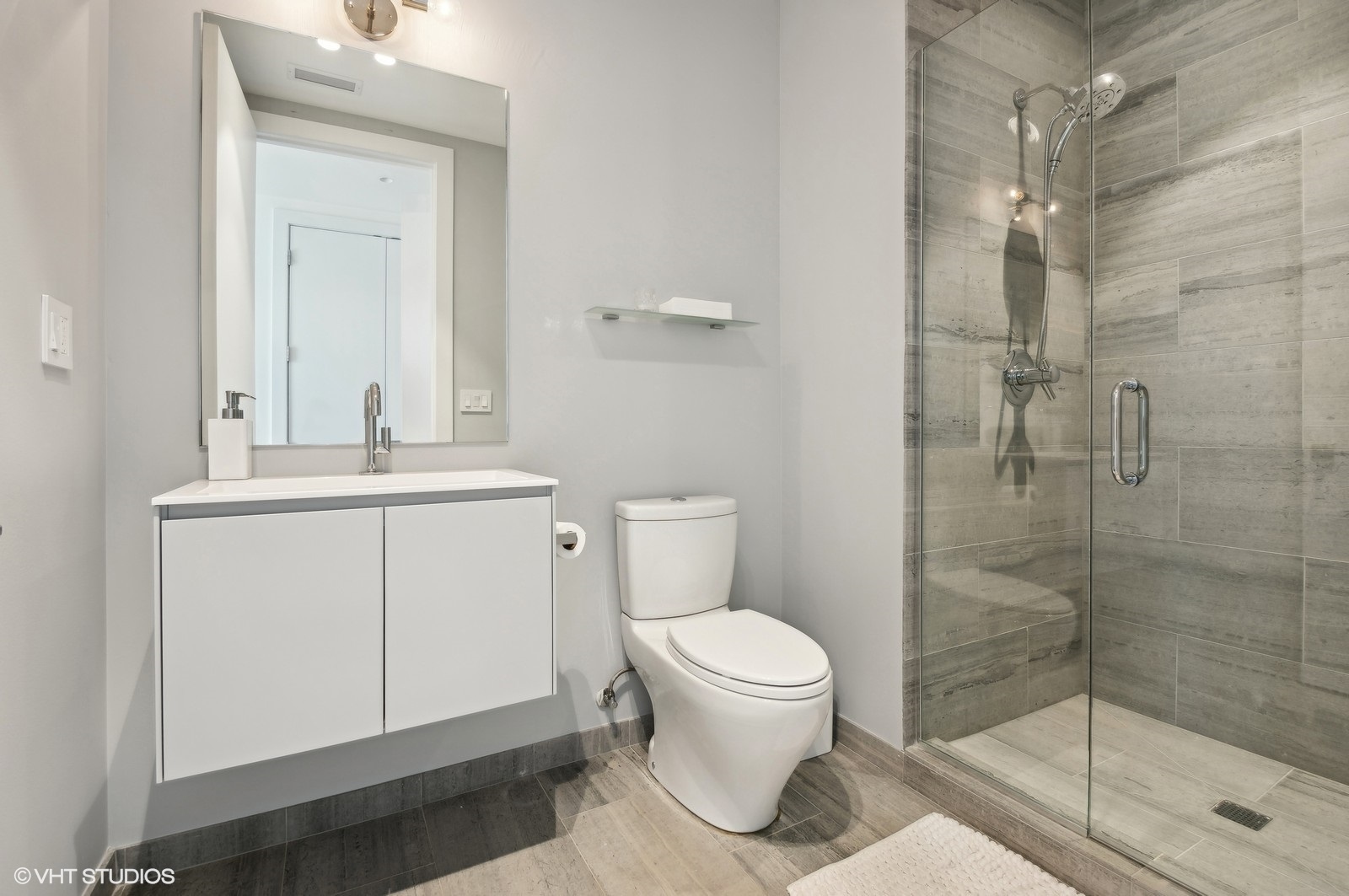 1625 North Burling Street, Unit 401 Chicago, IL 60614 - Photo 28 of 42 a bathroom with a sink a toilet and shower