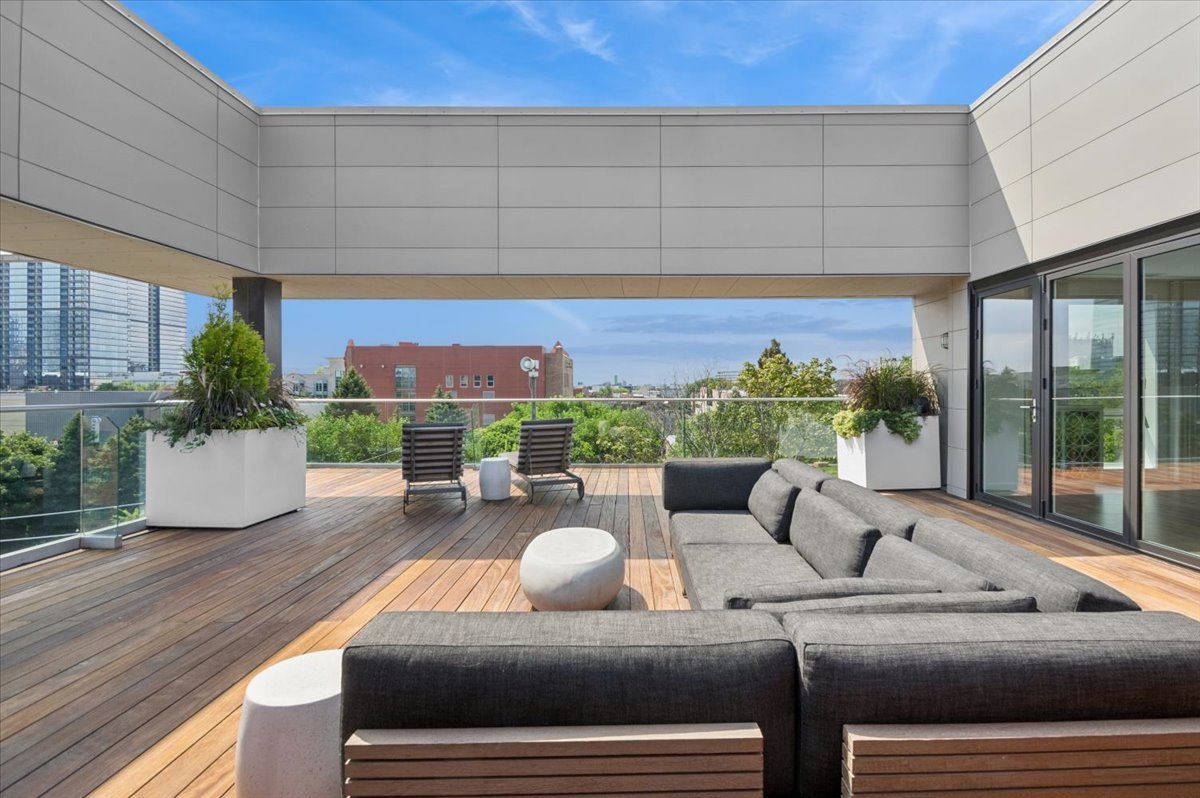 1625 North Burling Street, Unit 401 Chicago, IL 60614 - Photo 33 of 42 a living room with furniture and a floor to ceiling window