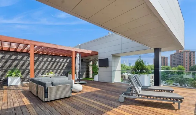 a view of a patio with a table and chairs