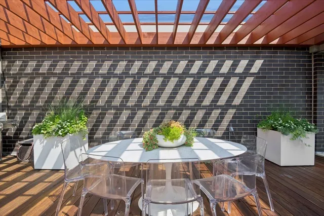 a table and chairs in front of a house