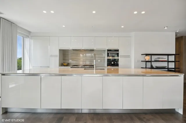 a kitchen with counter top space cabinets and appliances