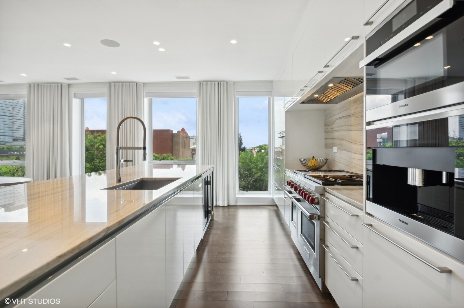 1625 North Burling Street, Unit 401 Chicago, IL 60614 - Photo 7 of 42 a large kitchen with stainless steel appliances a lot of counter space and a large window