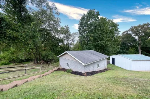 a view of a room with a yard and a garage