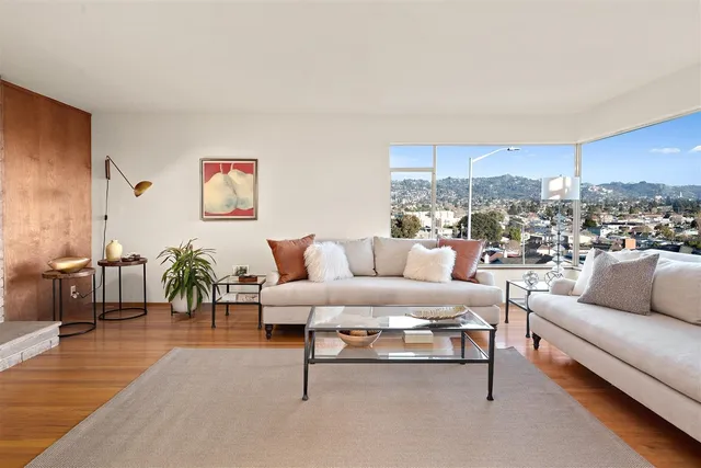 a living room with furniture and a rug