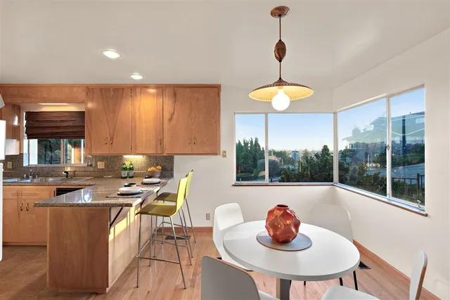 a kitchen with a sink and a refrigerator