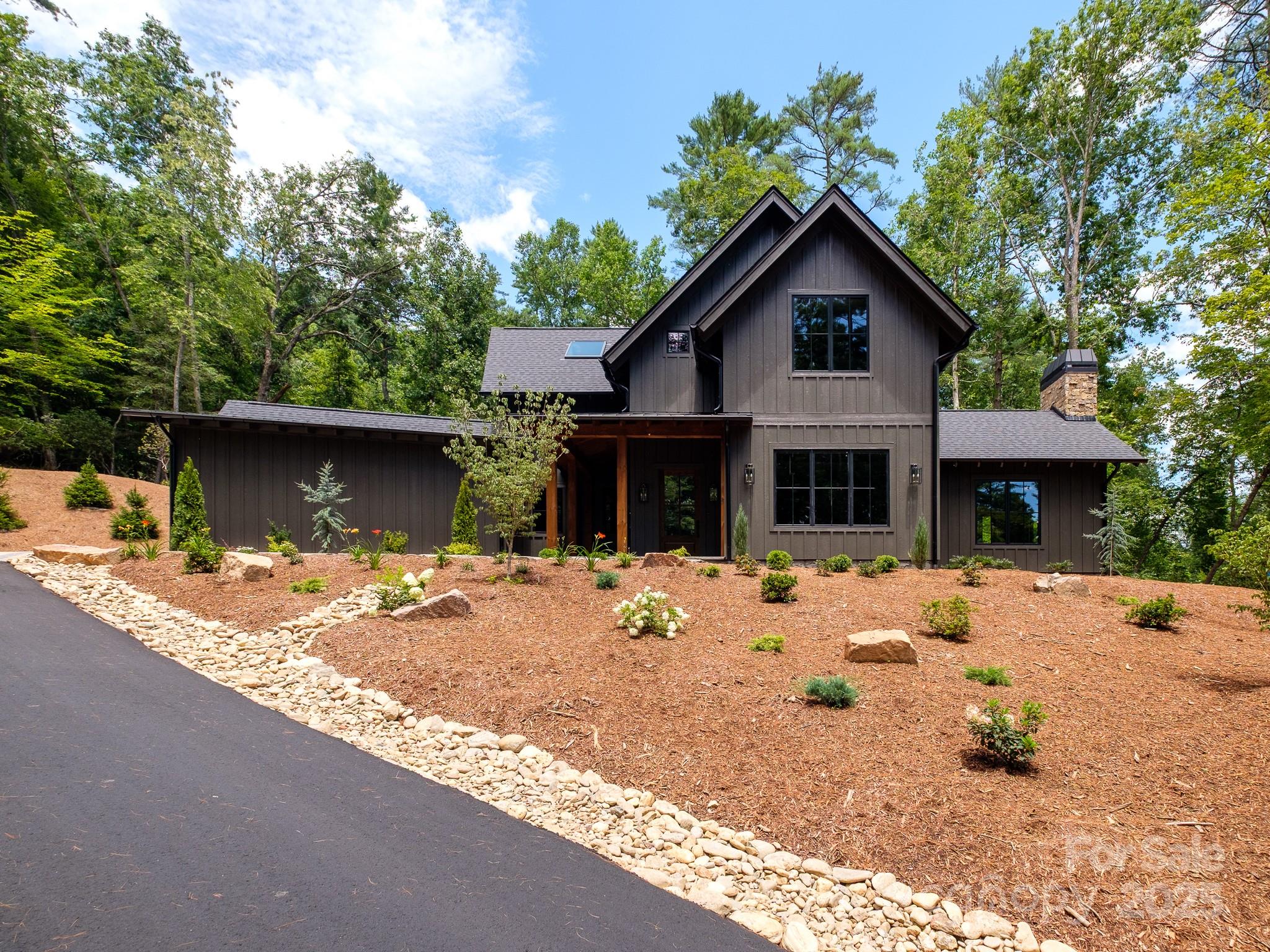 115 Rockbrook Overlook Brevard, NC 28712 - Photo 1 of 33 a front view of a house with a yard