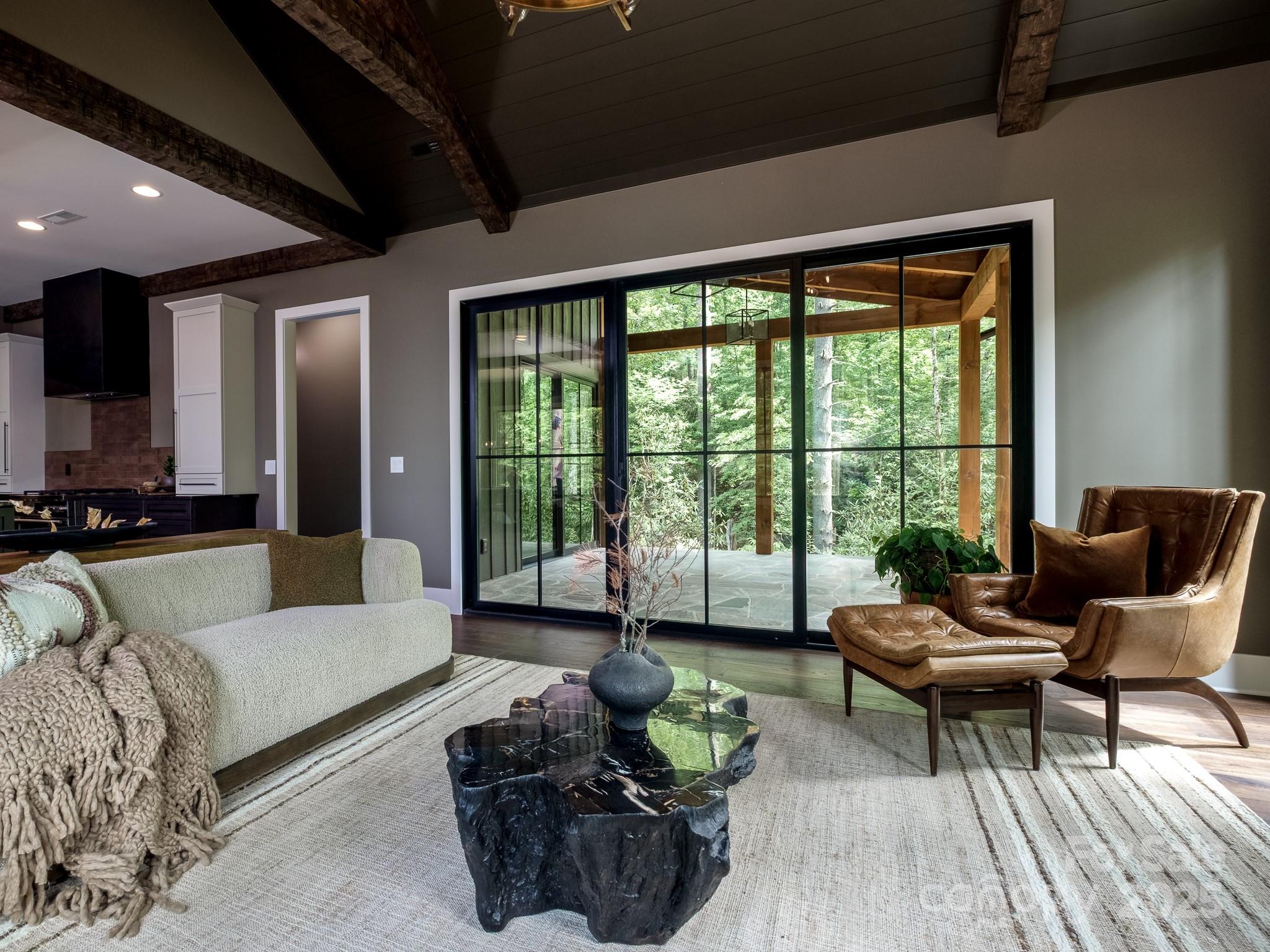 115 Rockbrook Overlook Brevard, NC 28712 - Photo 15 of 33 a living room with furniture and a large window