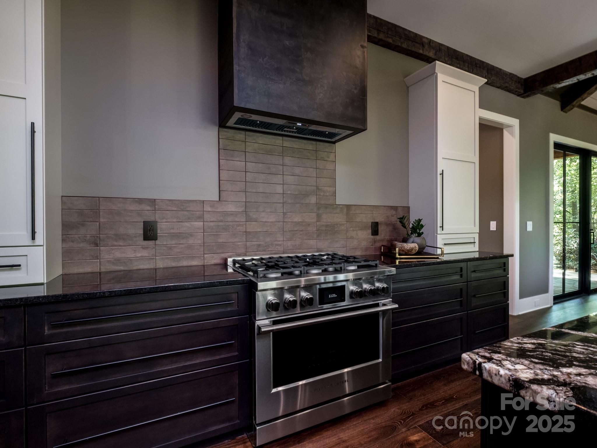 115 Rockbrook Overlook Brevard, NC 28712 - Photo 18 of 33 a kitchen with wooden cabinets and a stove top oven
