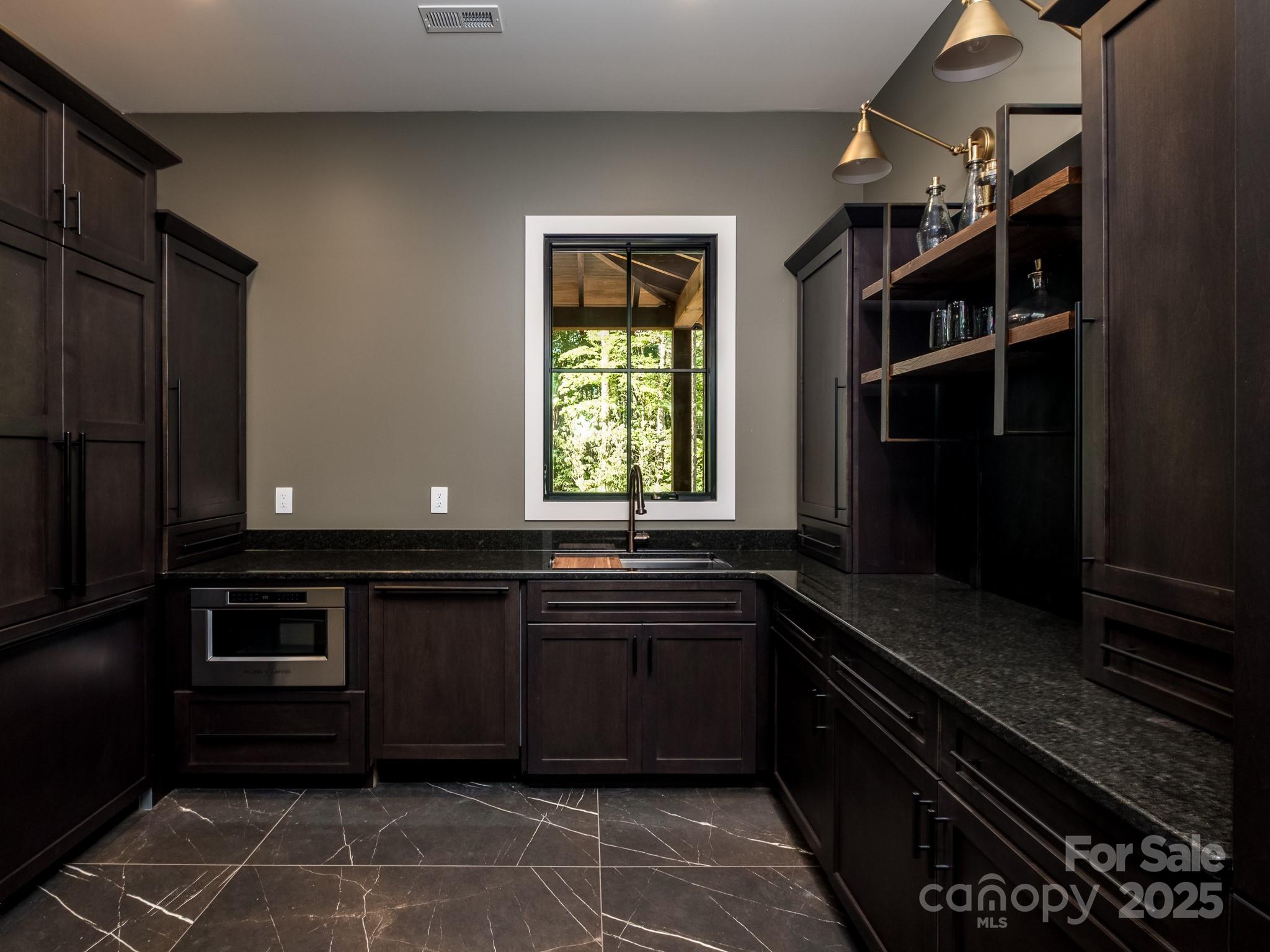 115 Rockbrook Overlook Brevard, NC 28712 - Photo 19 of 33 a kitchen with a sink and cabinets
