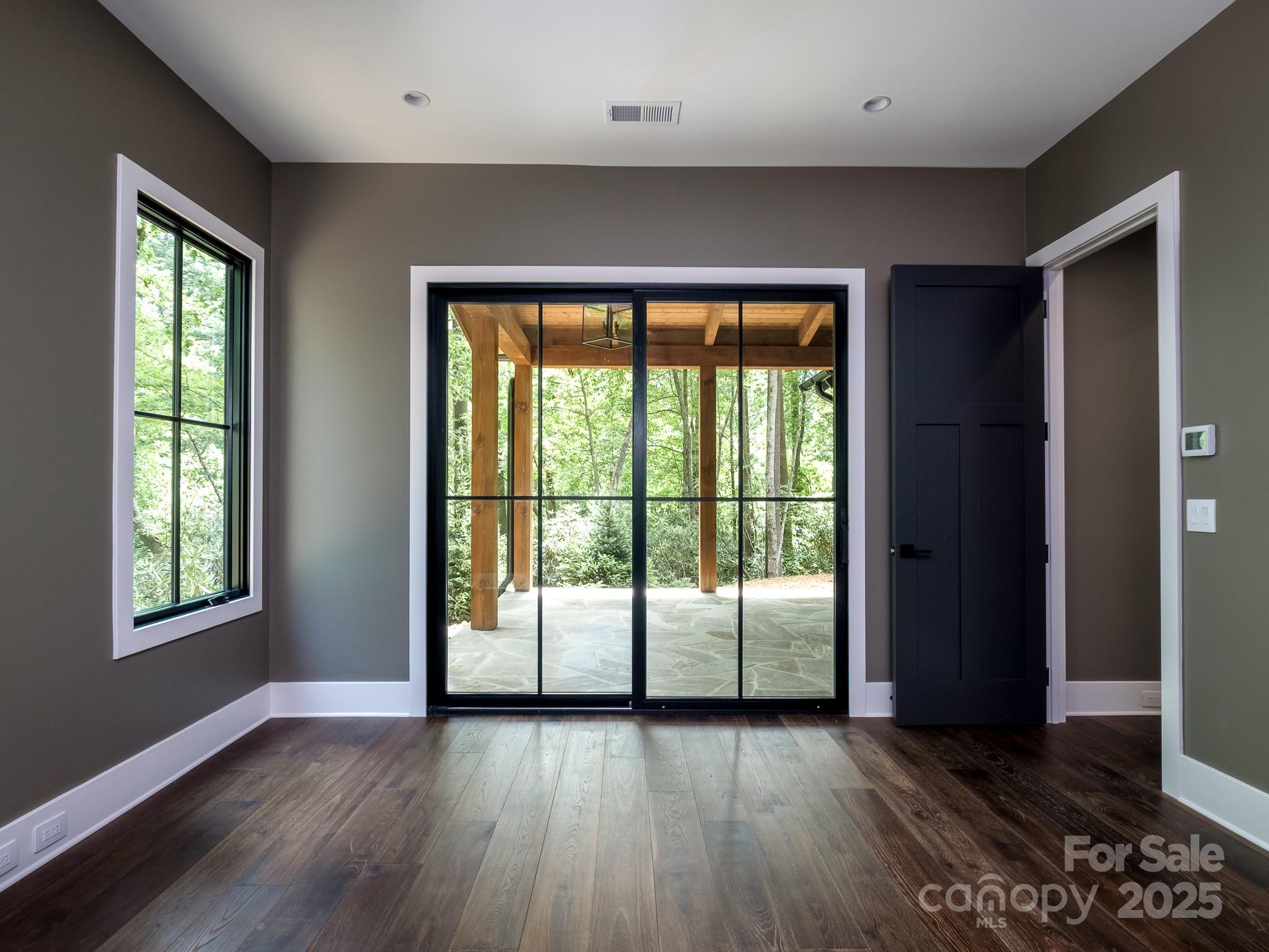 115 Rockbrook Overlook Brevard, NC 28712 - Photo 20 of 33 a view of an empty room with wooden floor and a window