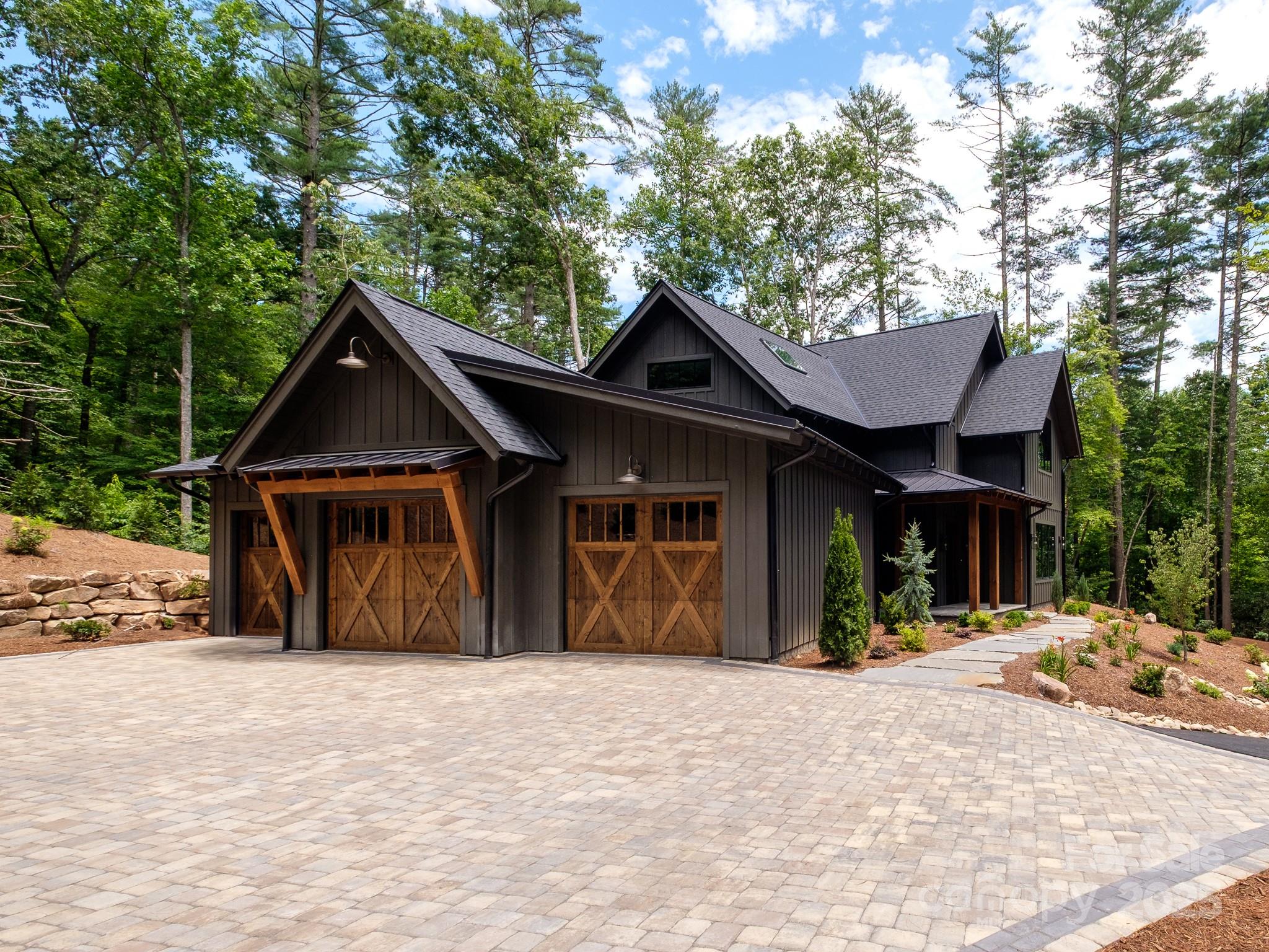 115 Rockbrook Overlook Brevard, NC 28712 - Photo 2 of 33 a front view of a house with a yard and trees