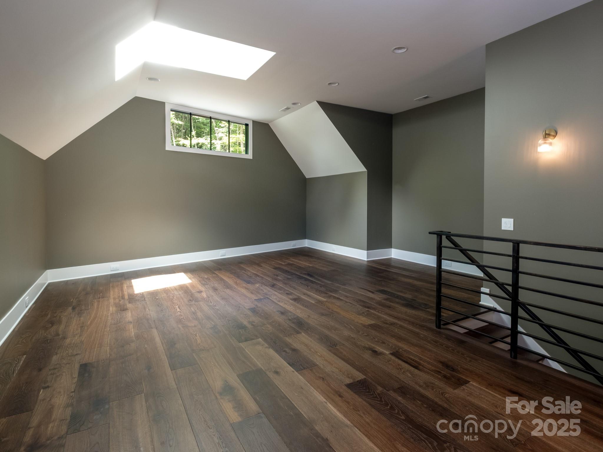 115 Rockbrook Overlook Brevard, NC 28712 - Photo 24 of 33 a view of an empty room with wooden floor and a window