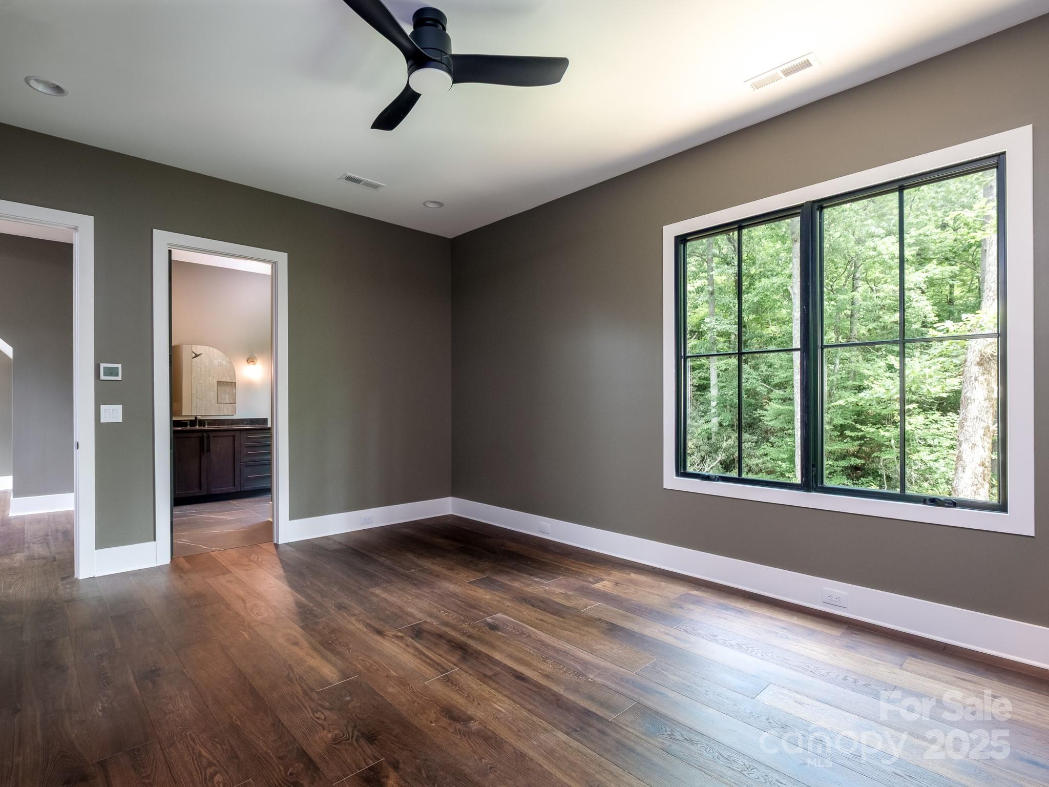 115 Rockbrook Overlook Brevard, NC 28712 - Photo 25 of 33 a view of an empty room with wooden floor and a window