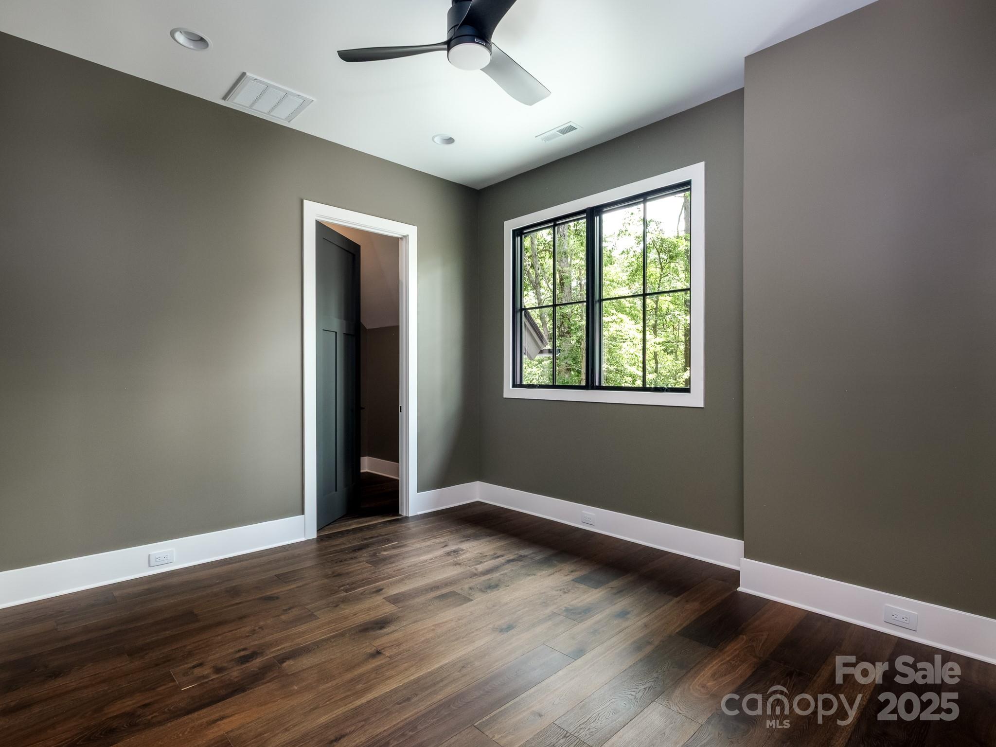 115 Rockbrook Overlook Brevard, NC 28712 - Photo 30 of 33 a view of an empty room with wooden floor and a window