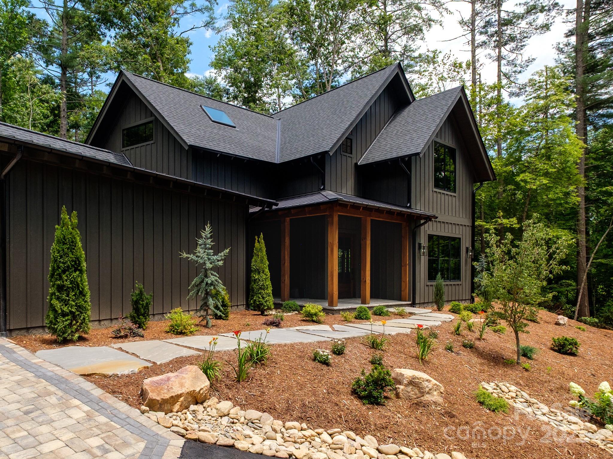 115 Rockbrook Overlook Brevard, NC 28712 - Photo 3 of 33 a front view of a house with a yard