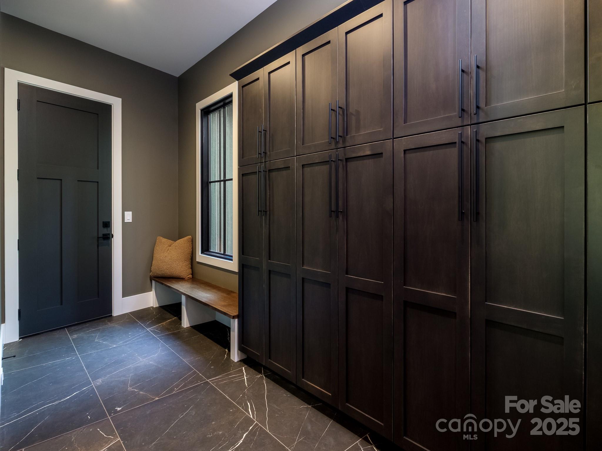115 Rockbrook Overlook Brevard, NC 28712 - Photo 32 of 33 a view of a closet area with lots of wooden furniture