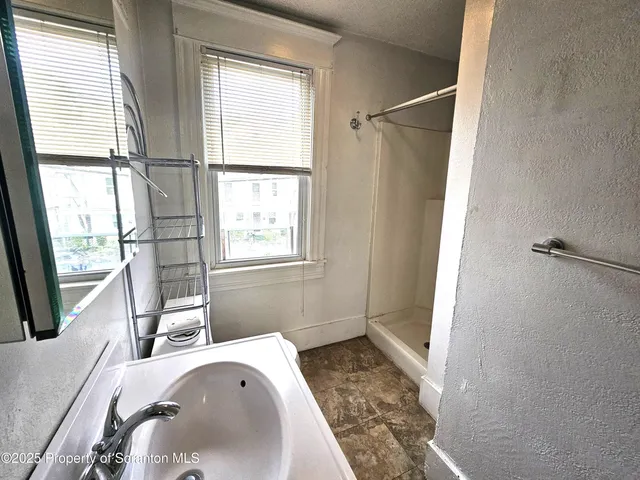 a bathroom with a sink and a tub