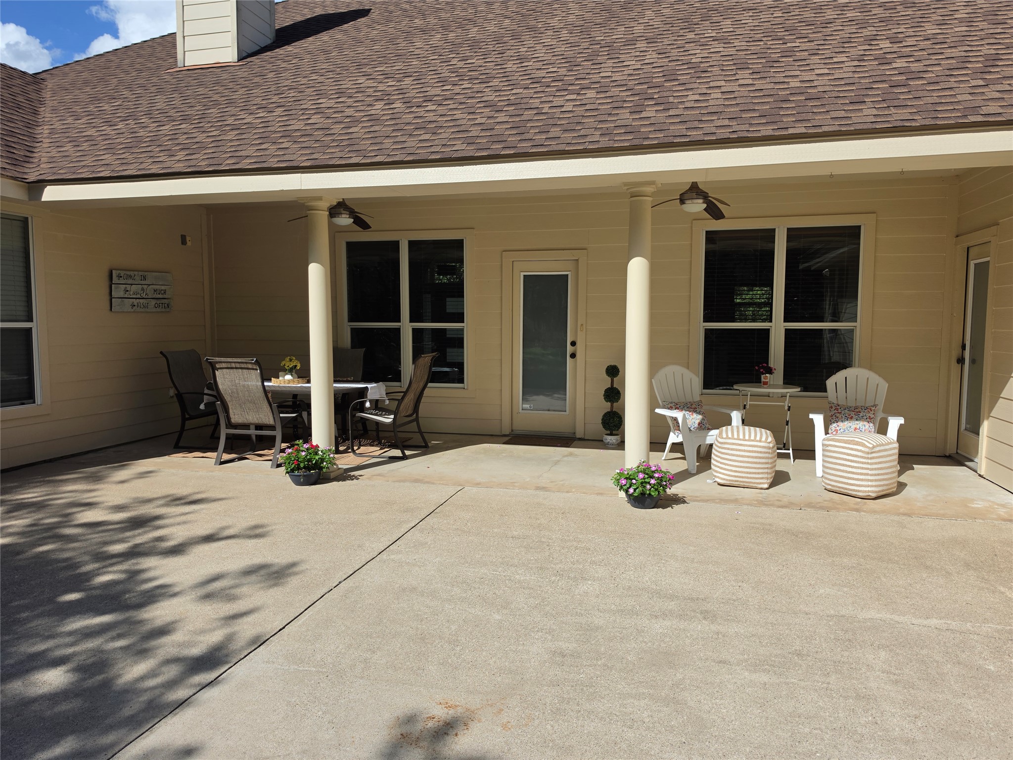 330 Arbors Circle Elgin, TX 78621 - Photo 36 of 37 An inviting covered patio offers a comfortable space for outdoor dining and relaxation.