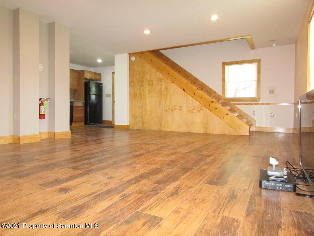 3328 Homets Ferry Road Wyalusing, PA 18853 - Photo 4 of 26 a view of a living room with wooden floor