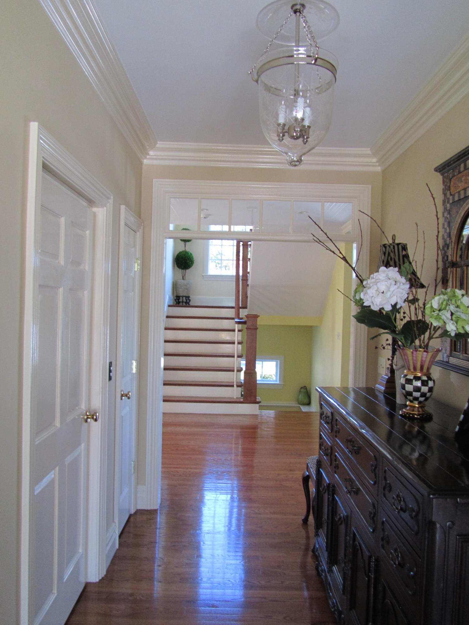 130 Main Street Osterville, MA 02655 - Photo 16 of 34 a view of a hallway with wooden floor and staircase