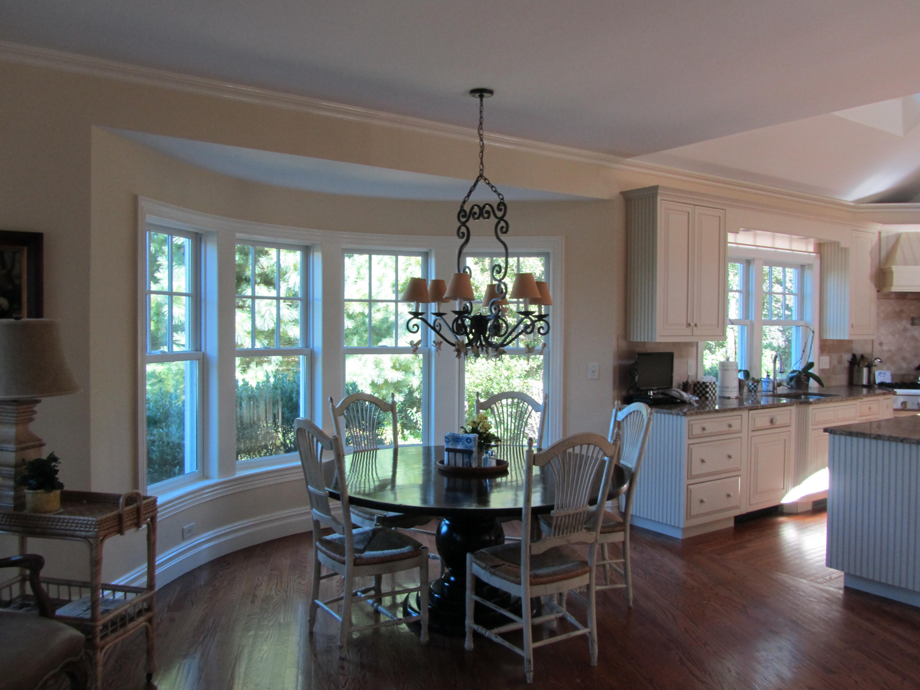 130 Main Street Osterville, MA 02655 - Photo 19 of 34 a dining room with furniture a chandelier and wooden floor