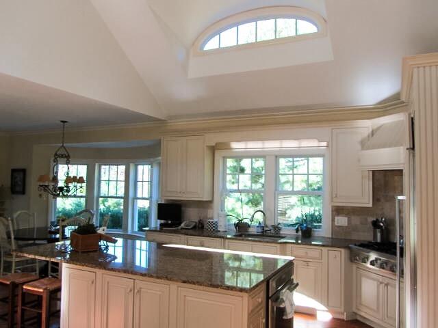 130 Main Street Osterville, MA 02655 - Photo 20 of 34 a kitchen with a sink stove and cabinets