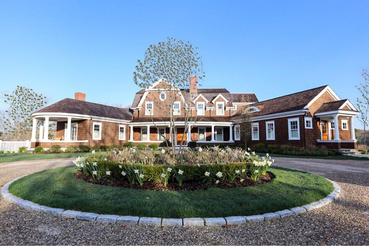 130 Main Street Osterville, MA 02655 - Photo 2 of 34 a front view of a house with a garden
