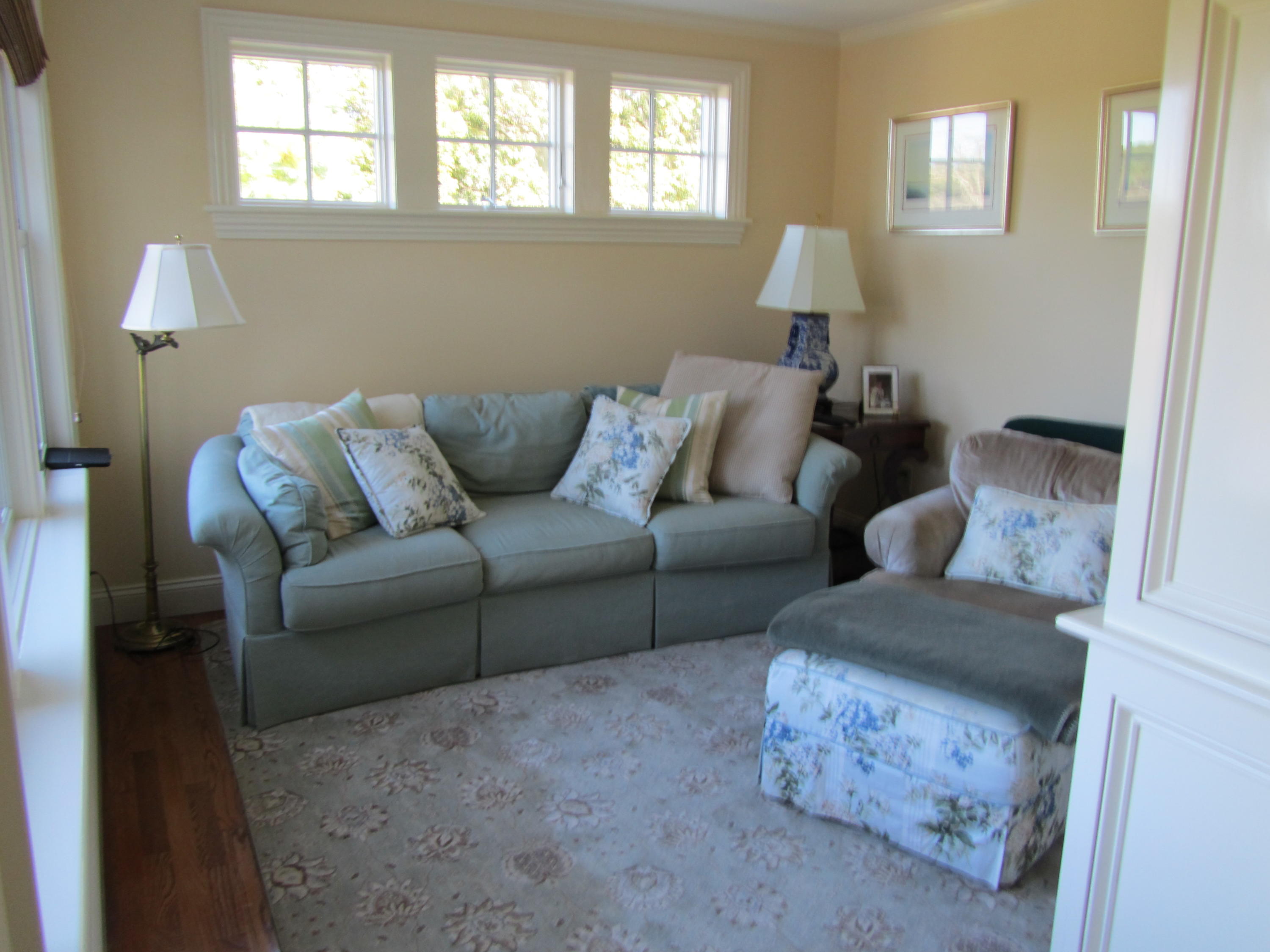 130 Main Street Osterville, MA 02655 - Photo 27 of 34 a living room with furniture and a lamp