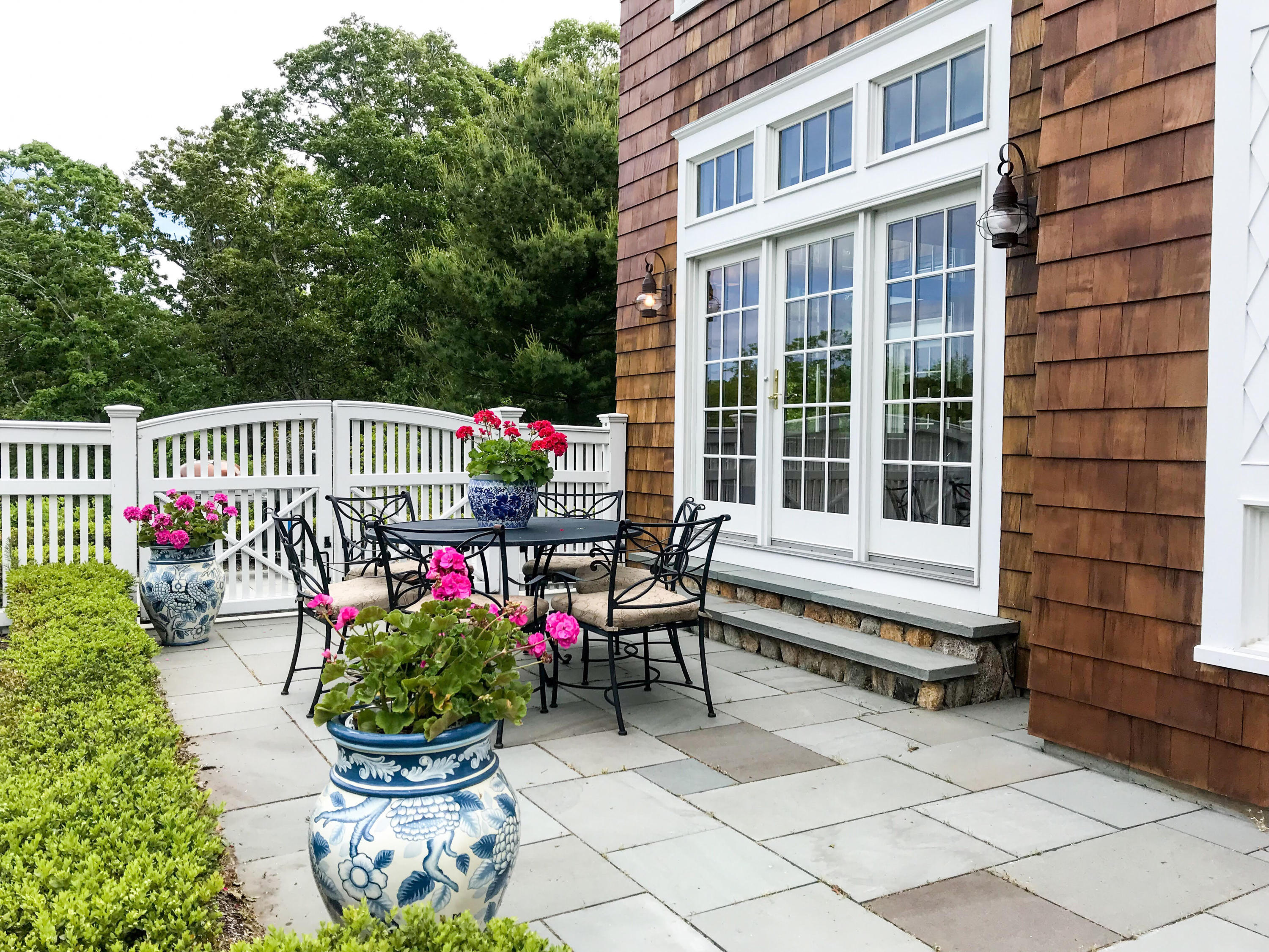 130 Main Street Osterville, MA 02655 - Photo 32 of 34 a view of a sitting area with furniture and wooden fence