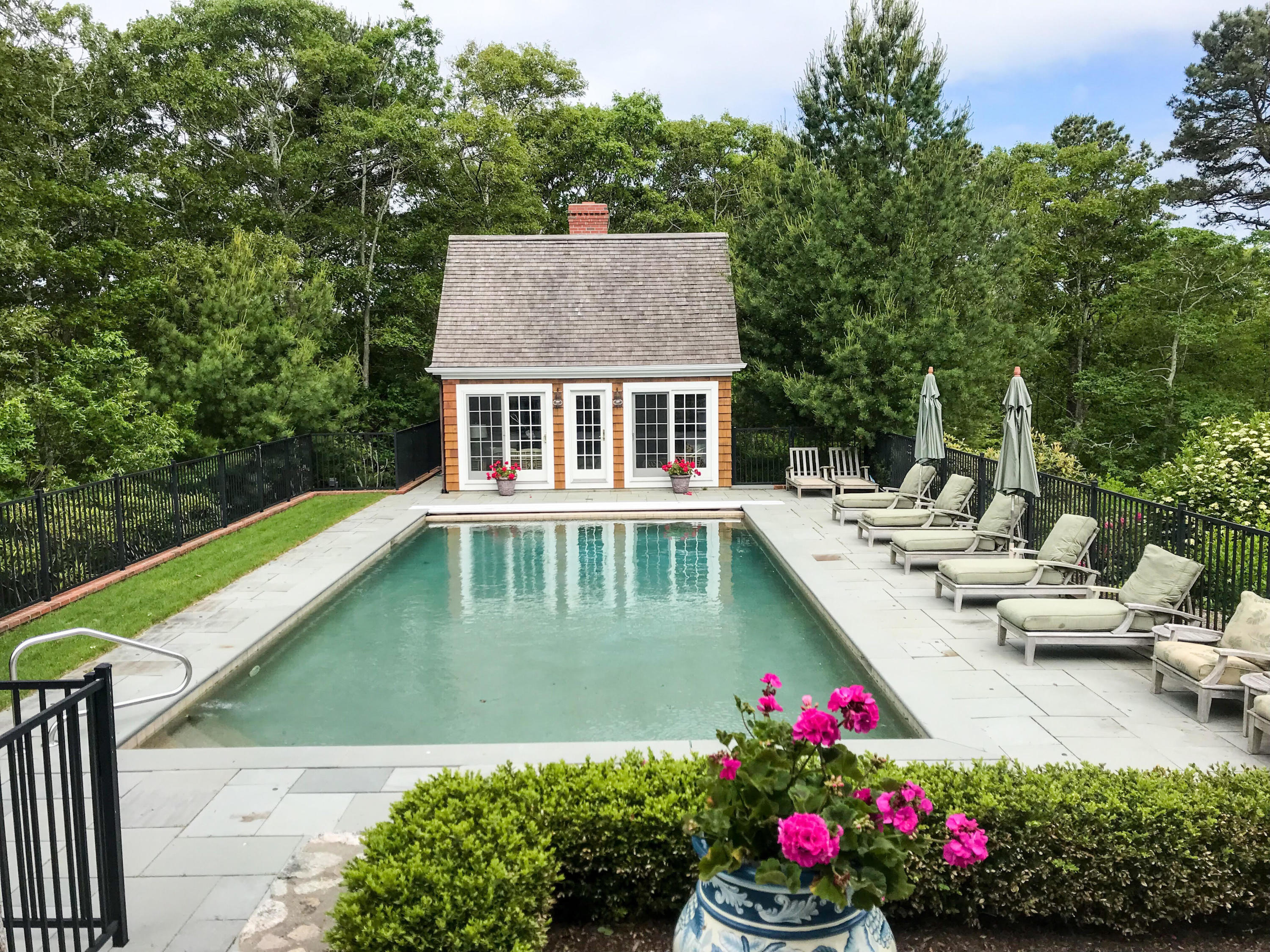 130 Main Street Osterville, MA 02655 - Photo 33 of 34 a view of a house with pool and chairs