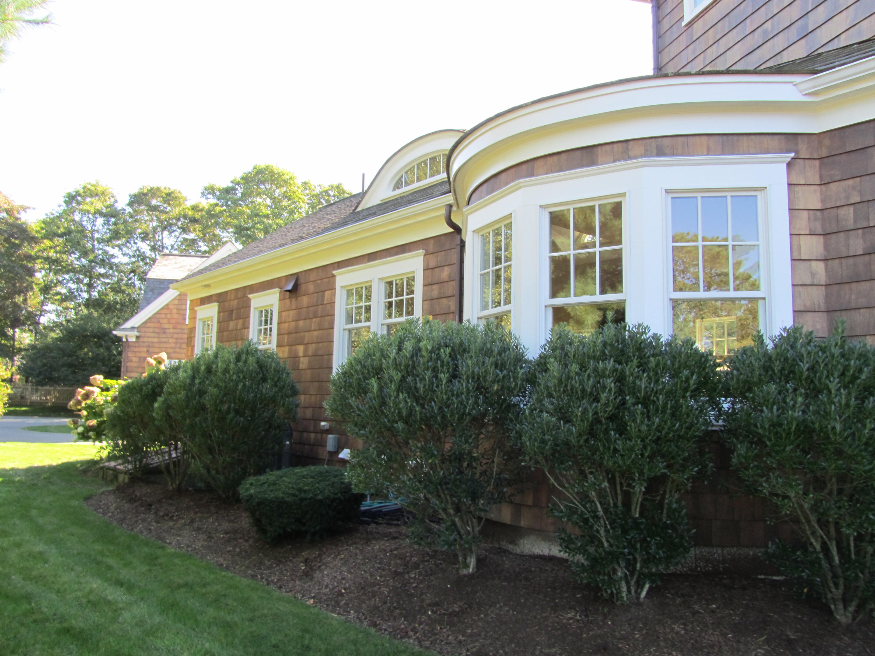 130 Main Street Osterville, MA 02655 - Photo 5 of 34 a front view of a house with garden