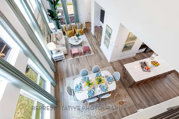 a picture of a living room with furniture and a fireplace