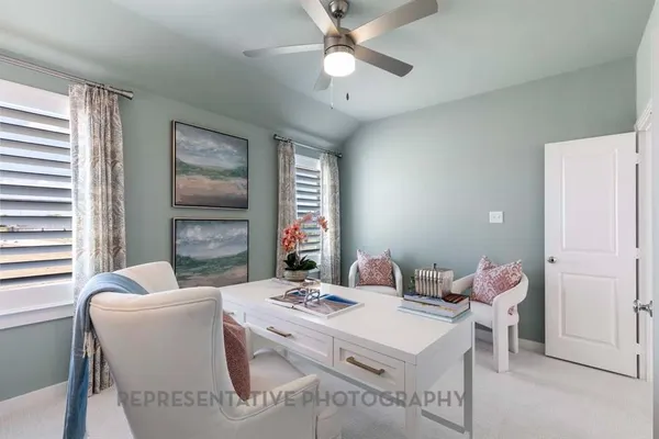 a dining room with furniture and window