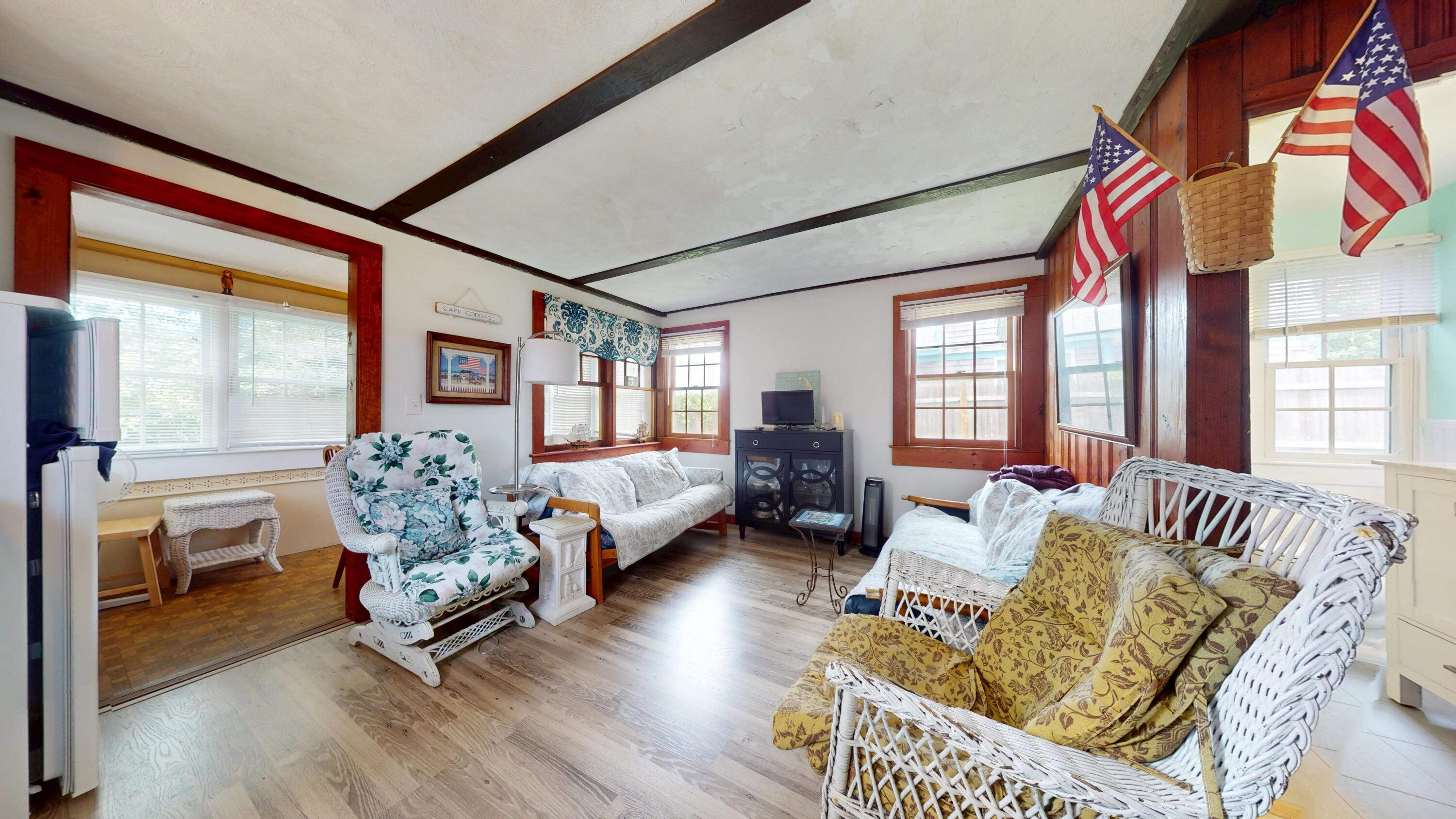 18 Myrtle Lane Dennis Port, MA 02639 - Photo 5 of 25 a living room with furniture and a large window