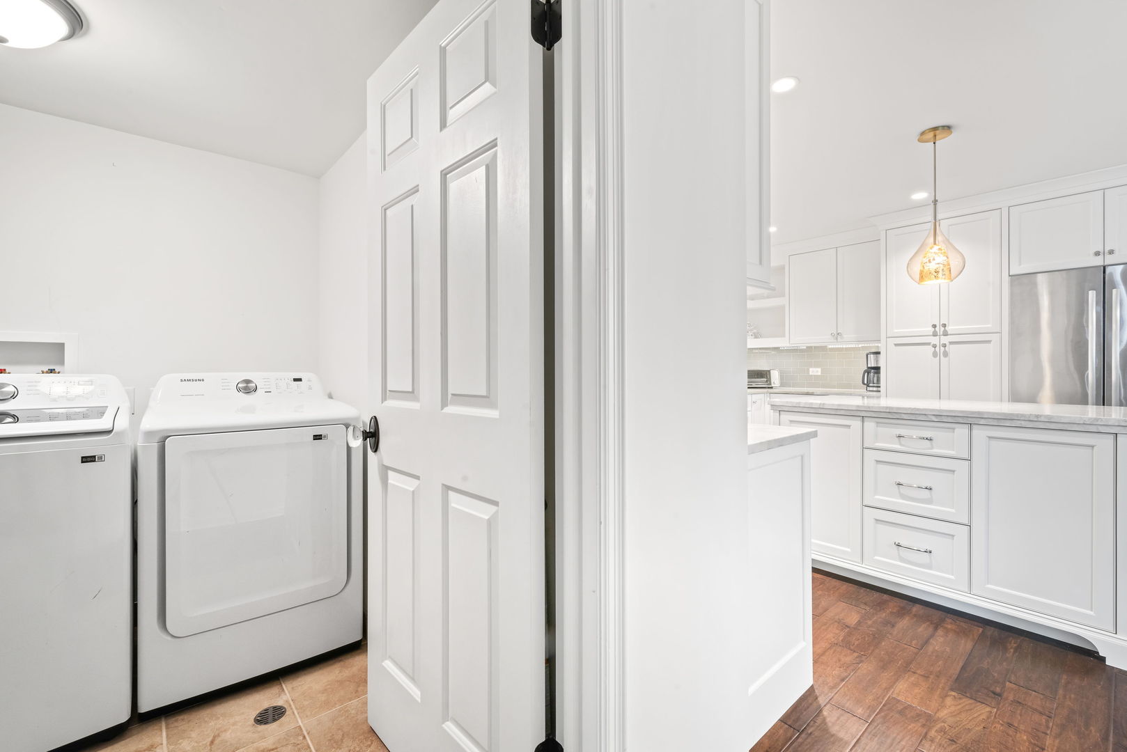 1409 Burr Oak Road, Unit 315A Hinsdale, IL 60521 - Photo 20 of 20 a kitchen with white cabinets and white appliances