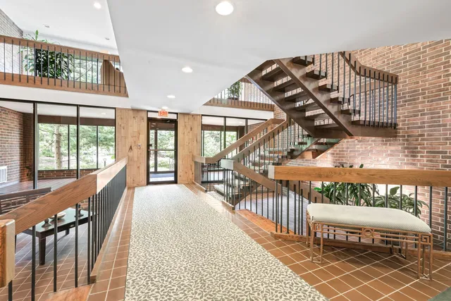 a view of a balcony with furniture