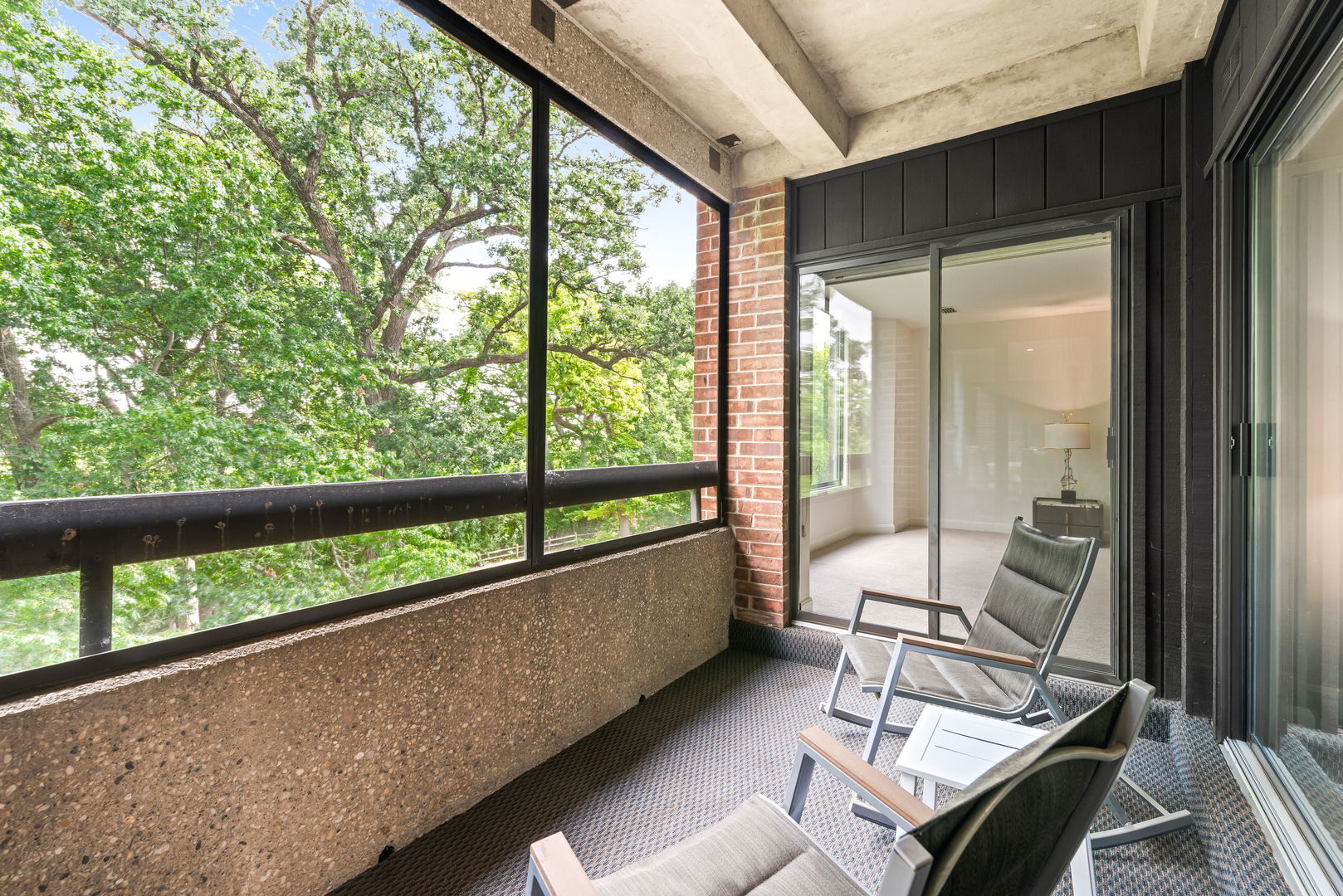 1409 Burr Oak Road, Unit 315A Hinsdale, IL 60521 - Photo 4 of 20 a living room with furniture and floor to ceiling windows