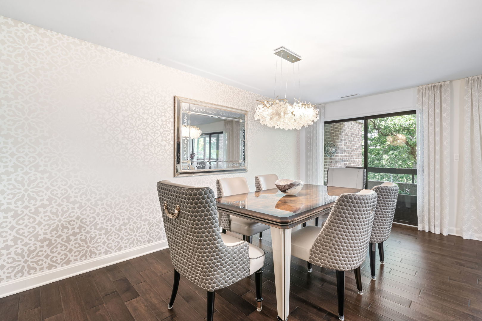 1409 Burr Oak Road, Unit 315A Hinsdale, IL 60521 - Photo 10 of 20 a dining room with furniture a chandelier and wooden floor