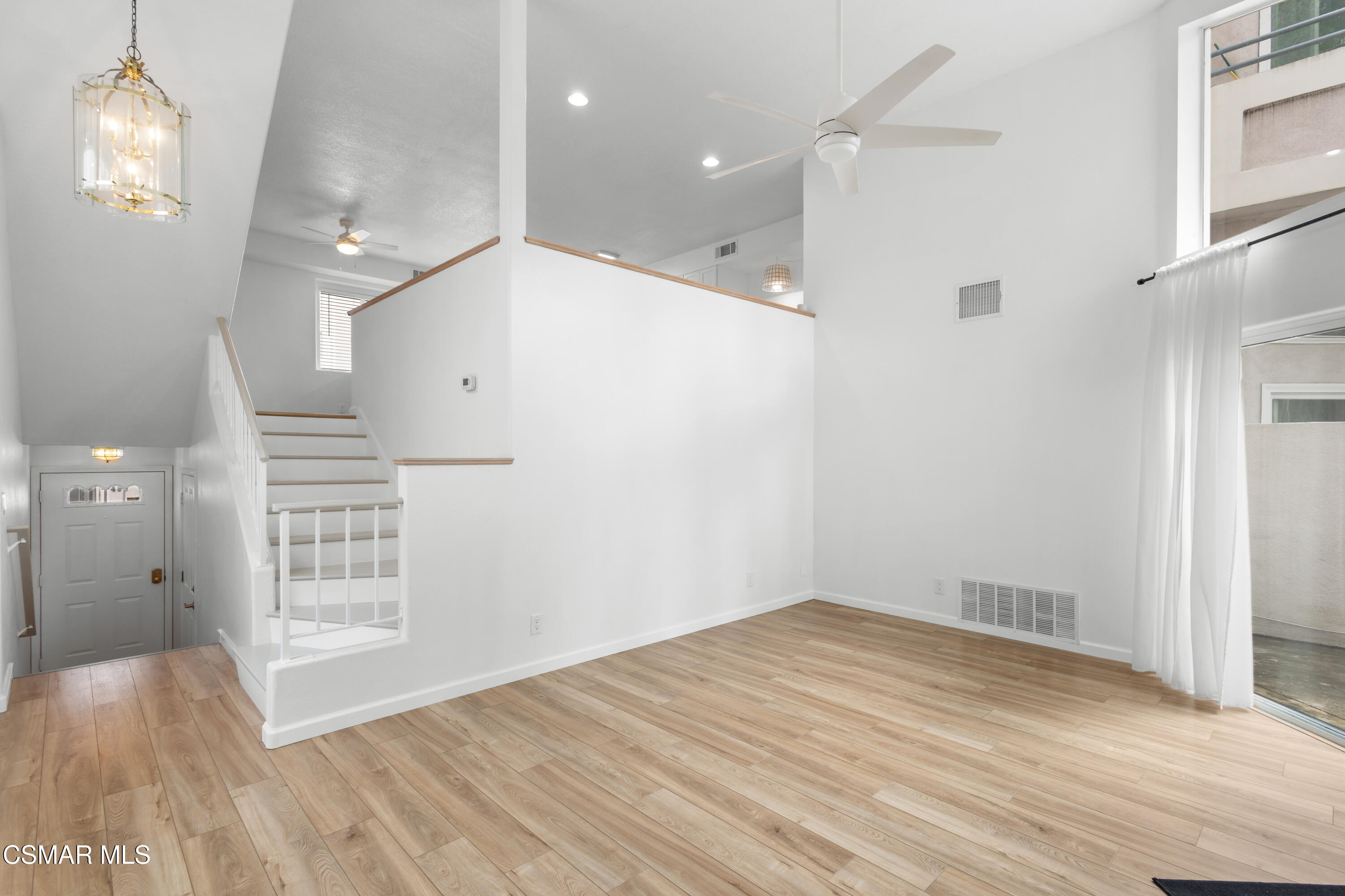 489 4th Place Port Hueneme, CA 93041 - Photo 11 of 34 a view of empty room with wooden floor and windows