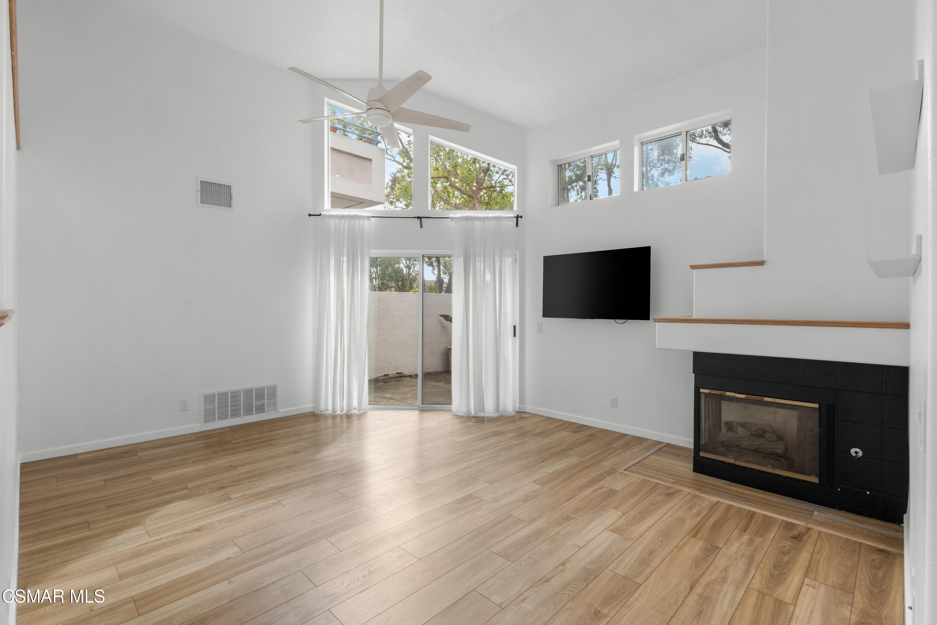 489 4th Place Port Hueneme, CA 93041 - Photo 13 of 34 a view of empty room with wooden floor and fireplace