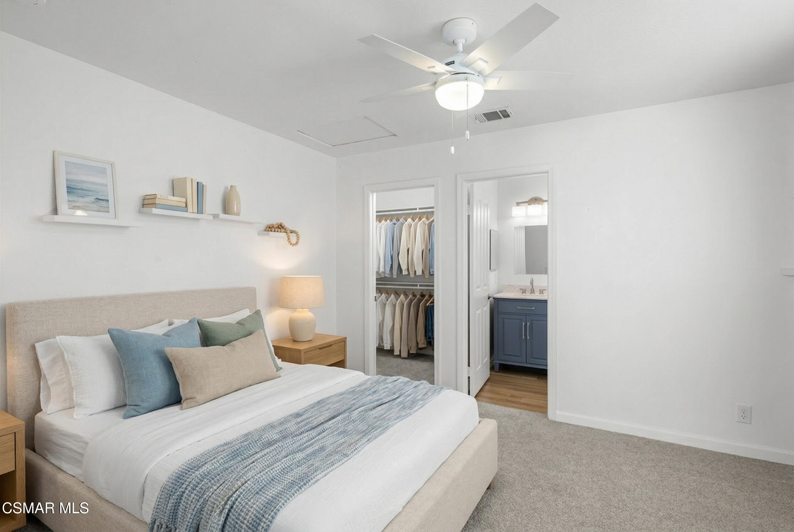 489 4th Place Port Hueneme, CA 93041 - Photo 25 of 34 a spacious bedroom with a bed and a chandelier