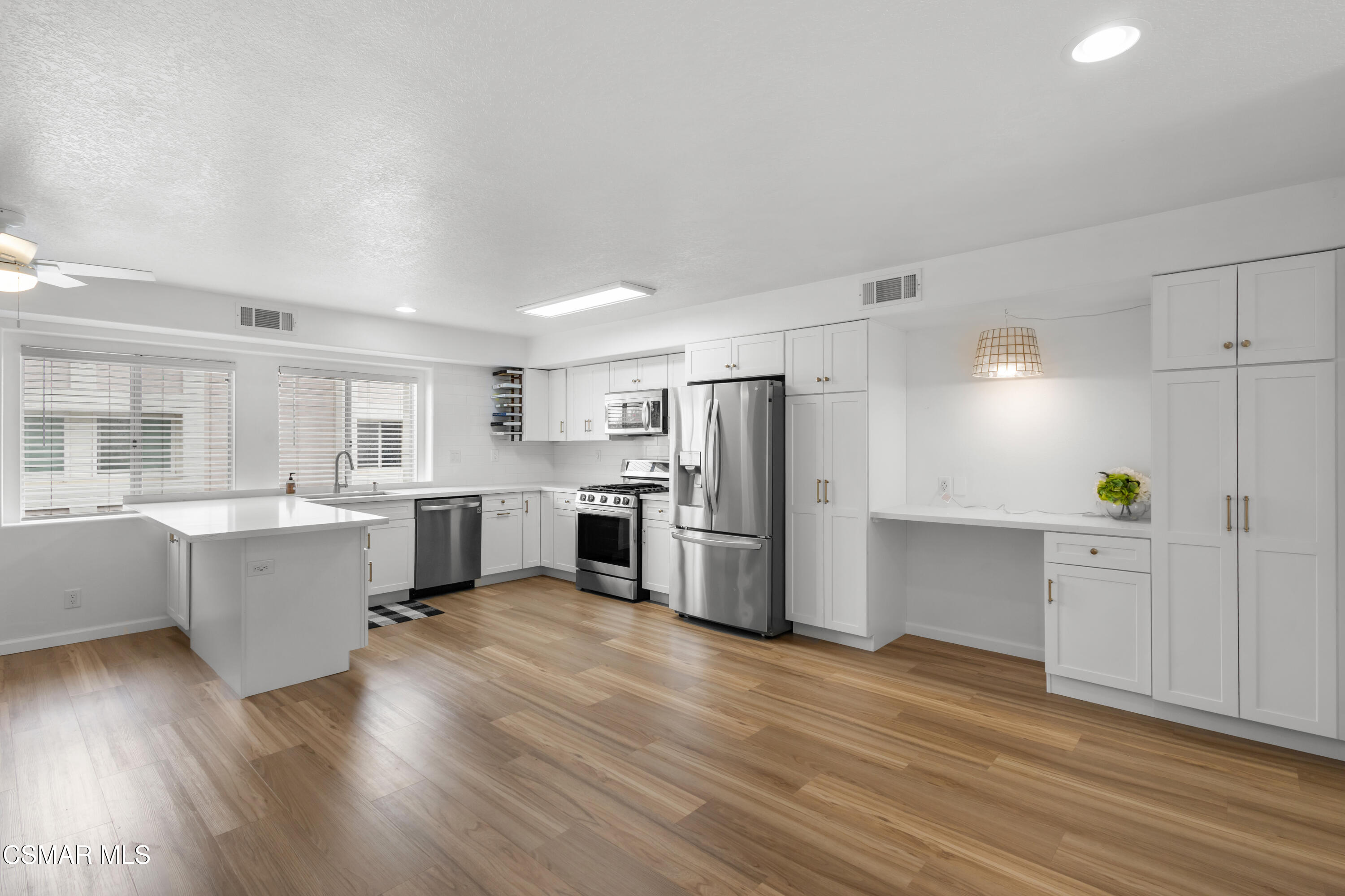 489 4th Place Port Hueneme, CA 93041 - Photo 8 of 34 a kitchen with stainless steel appliances a refrigerator and a stove top oven