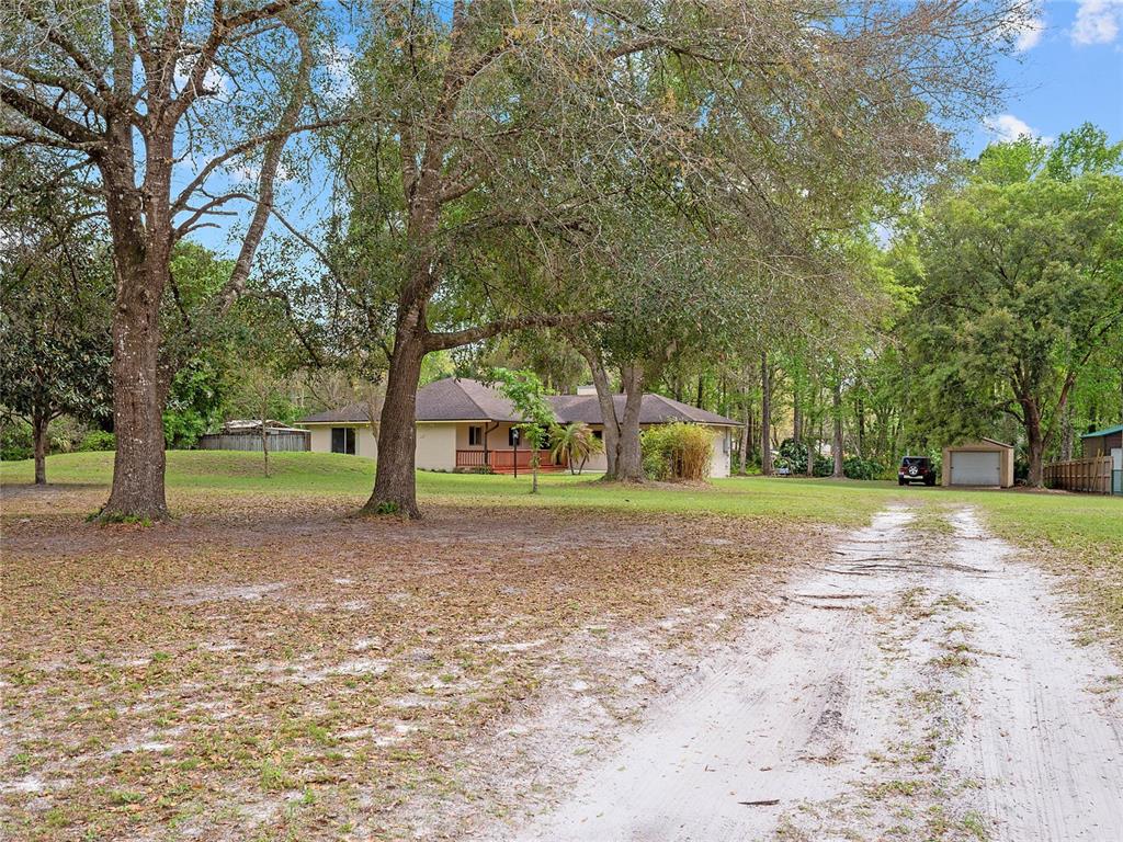 107 Calico Road Lake Mary, FL 32746 - Photo 1 of 1 Country living in the heart of Lake Mary - 4 Bedrooms, 2 Bathrooms on 1.19 ACRES full of gorgeous MATURE TREES, zoned for TOP-RATED Lake Mary Schools, with a LOW HOA and ZONED for HORSES!
