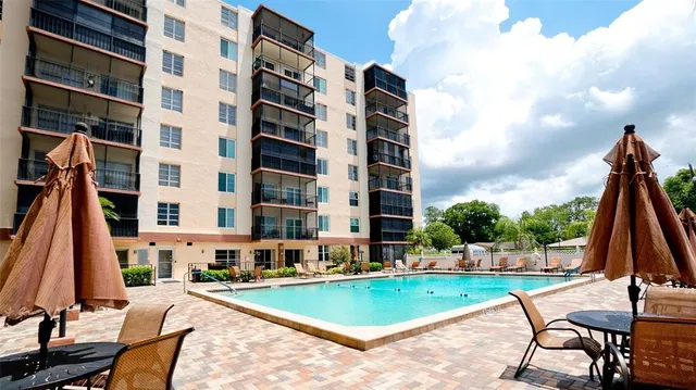 a view of a swimming pool with a lounge chair