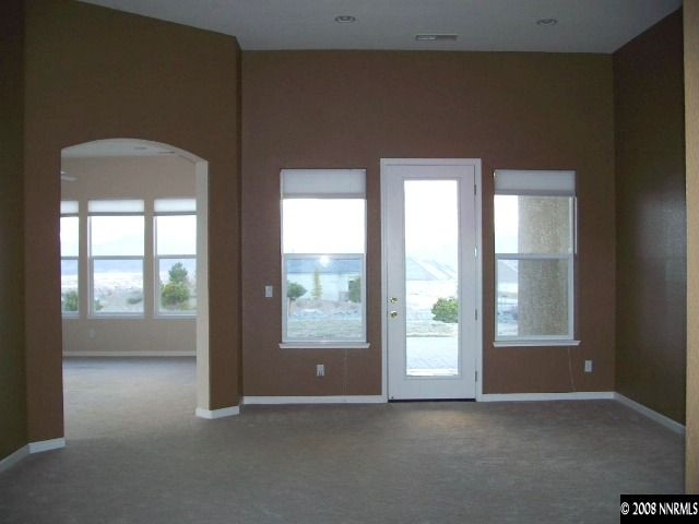 5585 North White Sands Road Reno, NV 89511 - Photo 3 of 9 an empty room with windows