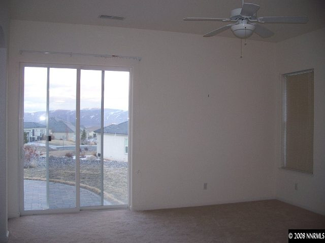 5585 North White Sands Road Reno, NV 89511 - Photo 6 of 9 wooden floor and window in a room