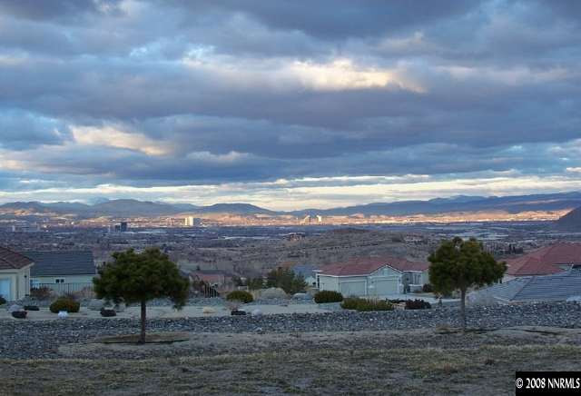 5585 North White Sands Road Reno, NV 89511 - Photo 9 of 9 a view of a street with sunset view