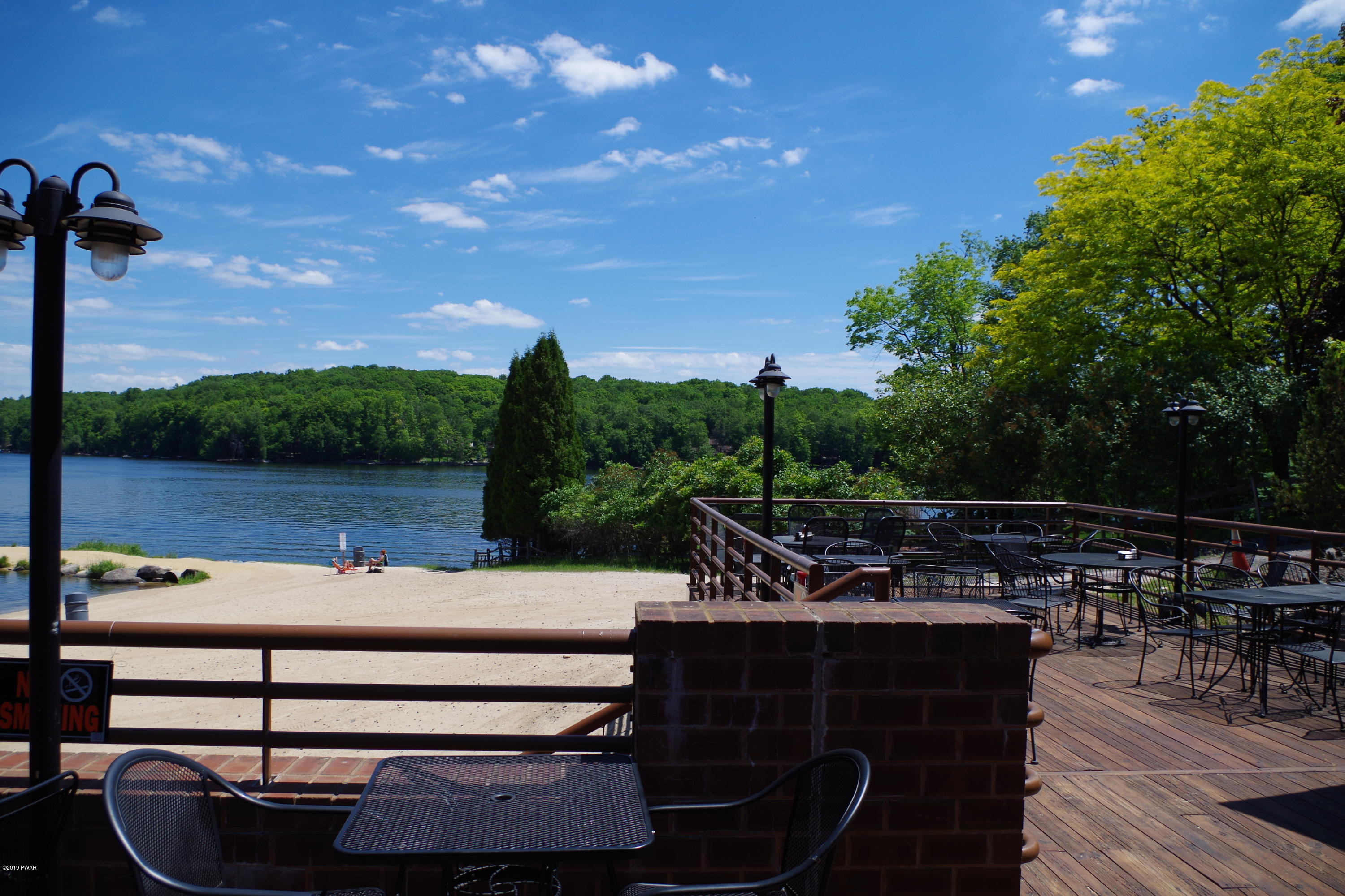 1271 Brookfield Road Lake Ariel, PA 18436 - Photo 71 of 143 a view of a patio with table and chairs a fire pit and a yard
