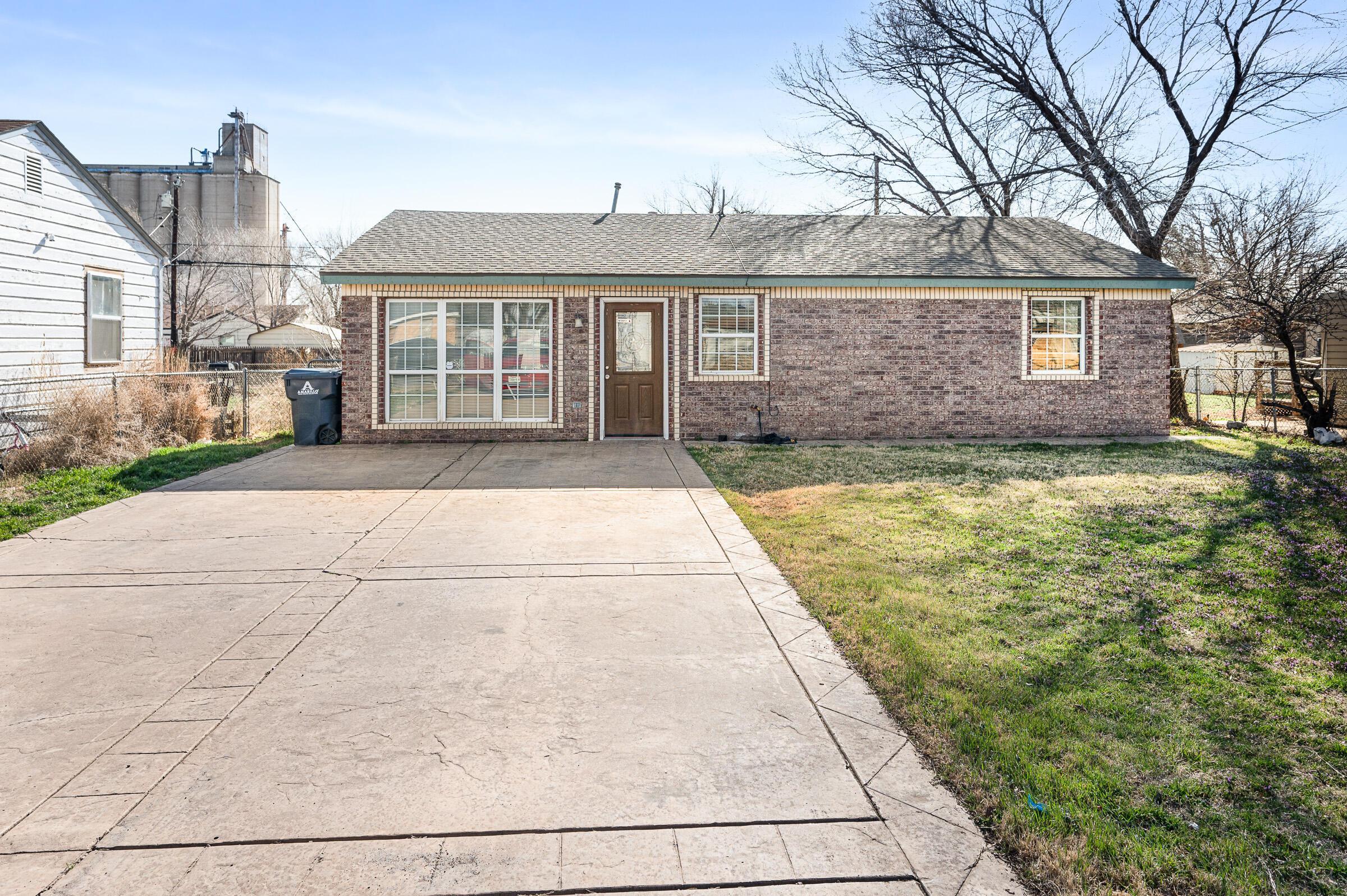 4351 South Tyler Street Amarillo, TX 79110 - Photo 1 of 18 a view of a house with a yard